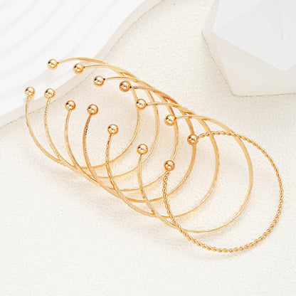 Golden Glow Luxe Bangle Set – 7 Delige Goudkleurige Armbandenset