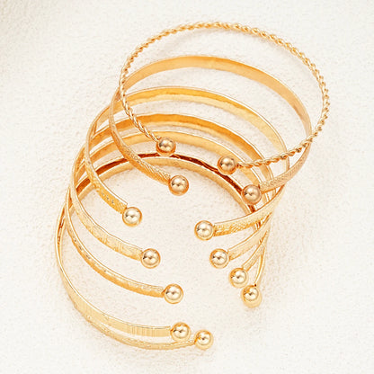 Golden Glow Luxe Bangle Set – 7 Delige Goudkleurige Armbandenset